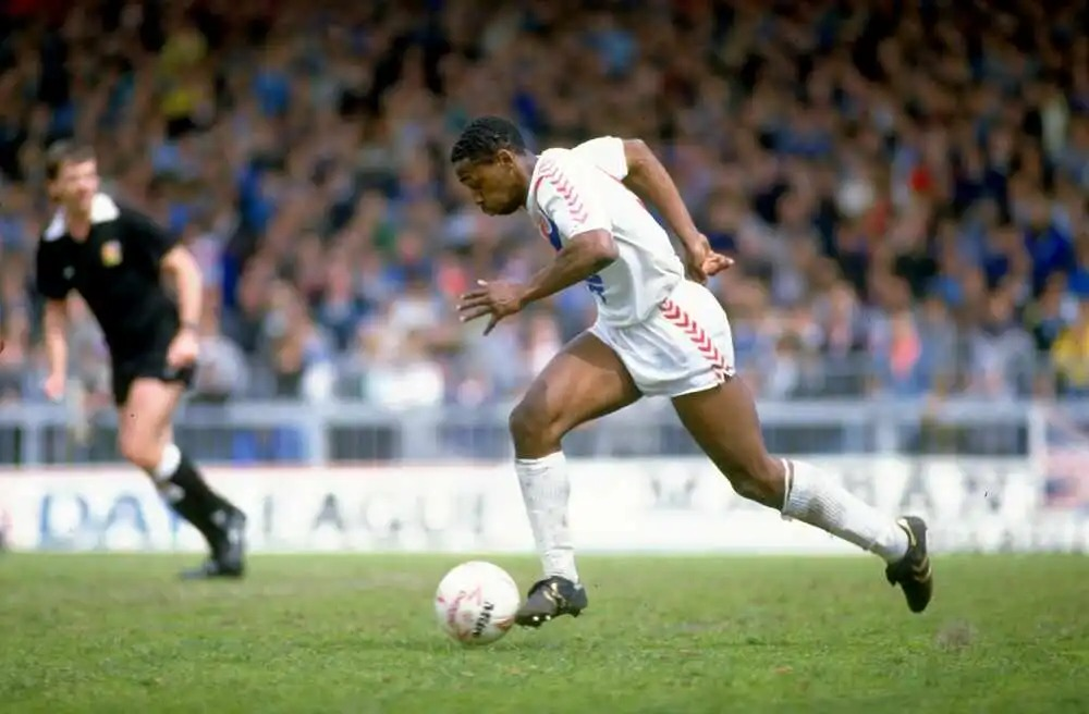 Colour action photo of Andy Gray of Crystal Palace running with the ball.